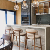 Taburete Monic de Madera de Almendro con Respaldo y Asiento Tapizado en Tela Piel Hielo 582